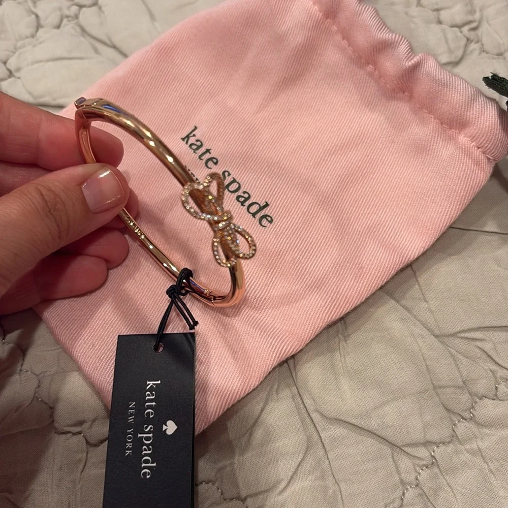 Rose gold Kate Spade bracelet with bow on top. Never used. Tag included. - Picture 3 of 4